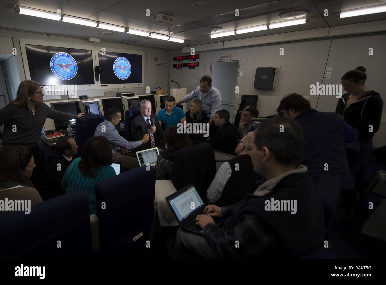 Secretary of Defense Jim Mattis briefs media aboard an E-4B National Airborne Operations Center aircraft over the Atlantic Ocean Feb. 14, 2017, en route to Brussels, Belgium, for the NATO Defense Ministerial. Stock Photo