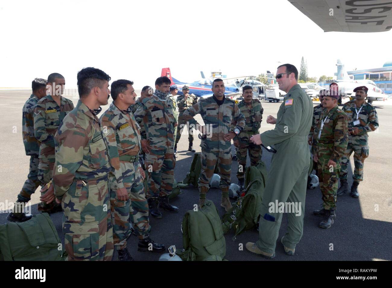 A U.S. Air Force C-130 Super Hercules pilot assigned to the 143rd Airlift  Wing, Rhode Island Air National Guard, briefs Indian Air Force Airmen prior  to a joint U.S. and India Special