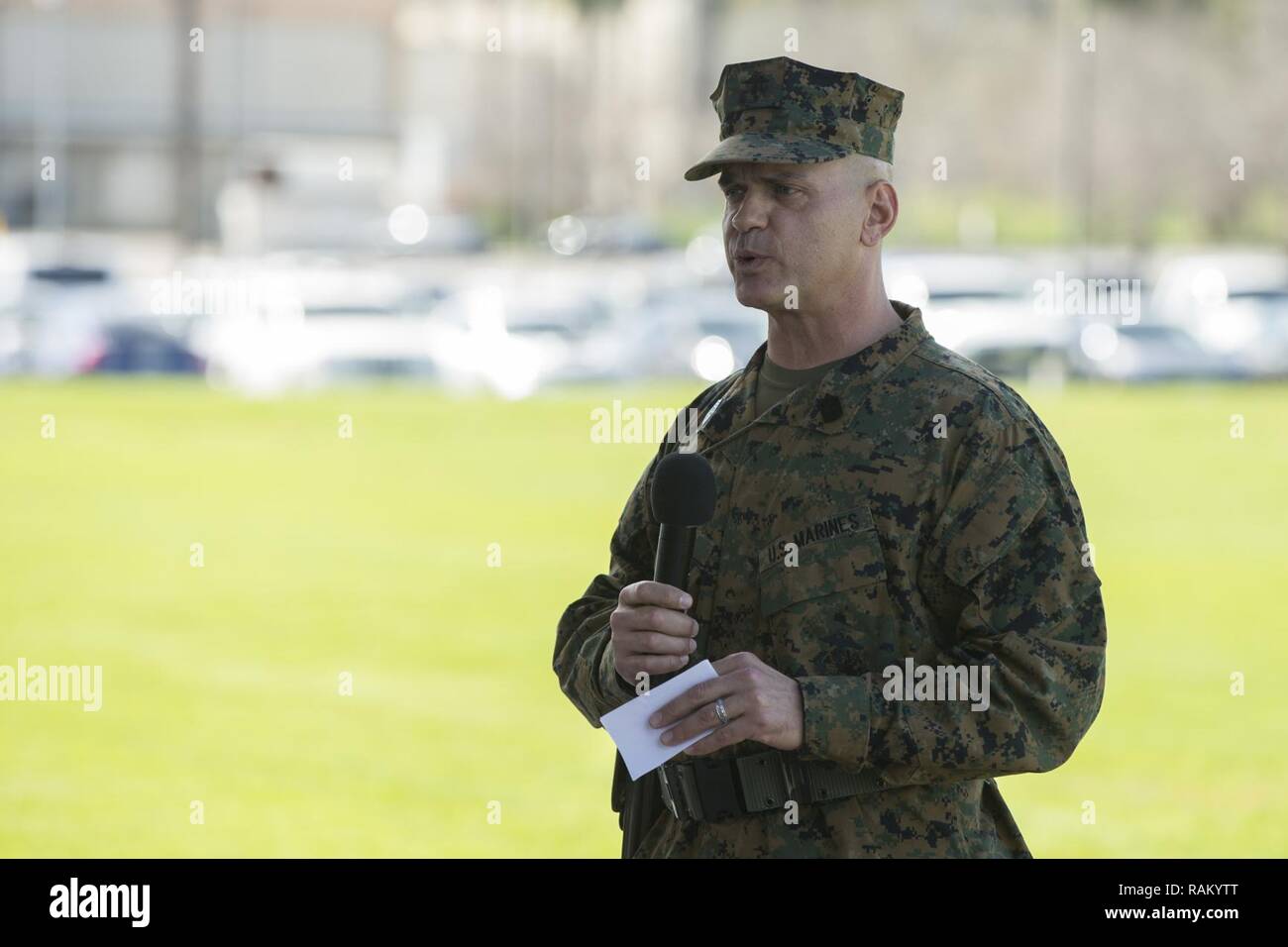 U.S. Marine Corps Sgt. Maj. Michael R. Saucedo, outgoing sergeant major, Headquarters and Support Battalion, Marine Corps Installations West, Marine Corps Base, Camp Pendleton, addresses the audience during a relief and appointment ceremony at the 11 area parade field on Camp Pendleton, Calif., Feb. 16, 2017. Stock Photo