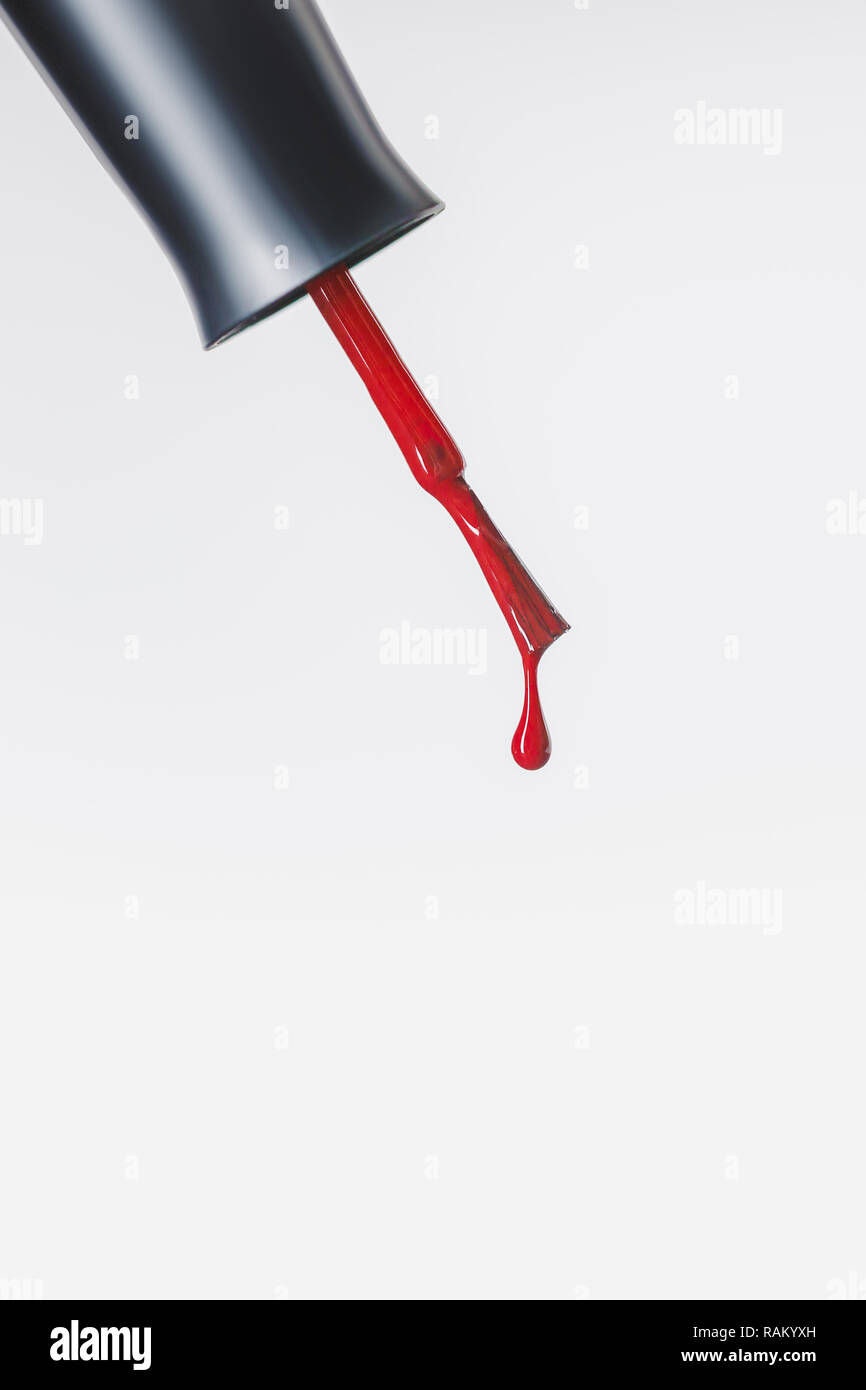 nail polish brush with red drop isolated on grey Stock Photo Alamy