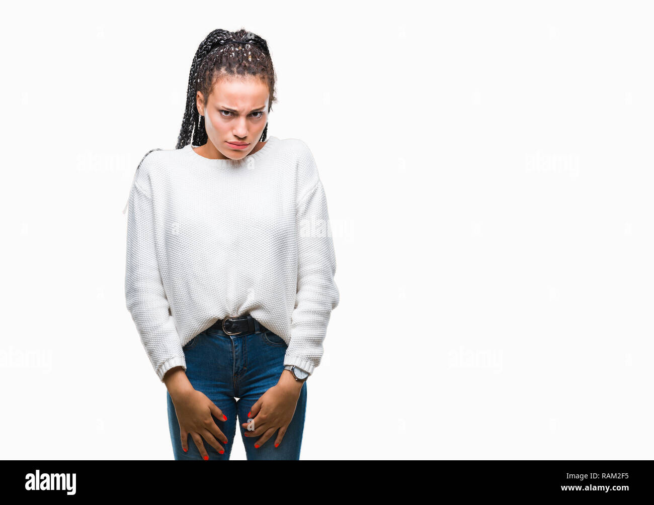 Young braided hair african american girl wearing winter sweater over isolated background skeptic and nervous, frowning upset because of problem. Negat Stock Photo
