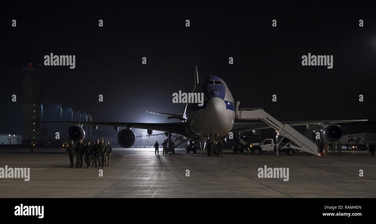 The crew of the E-4B National Airborne Operations Center greets the delegation of Secretary of Defense Jim Mattis at Al Dhafra Air Base in the United Arab Emirates, Feb. 20, 2017. Stock Photo