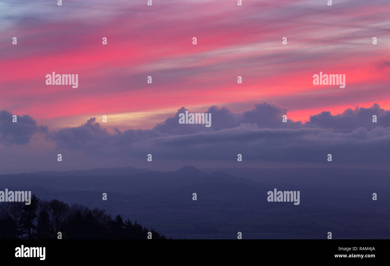 Pink twilight sky over Shropshire Hills in United Kingdom at autumn Stock Photo