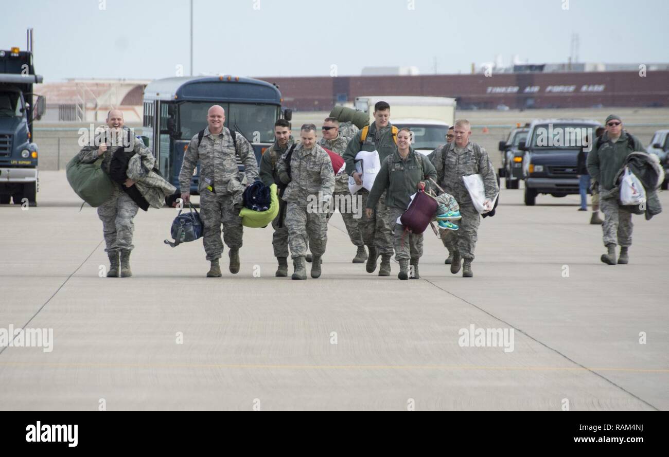 Reserve Citizen Airmen from the 507th Air Refueling Wing at Tinker Air Force Base, Okla., walk across the flightline to greet their loved ones upon returning return home following a deployment Feb. 17, 2017. More than 90 Reserve Citizen Airmen from the 507th ARW deployed in December 2016 in support of air operations at Incirlik Air Base, Turkey. The deployed crews flew 580 missions across 3,027 flight hours, delivering 35.3 million pounds of fuel to 3,413 receiver aircraft, all while being separated from loved ones over the holidays. Stock Photo