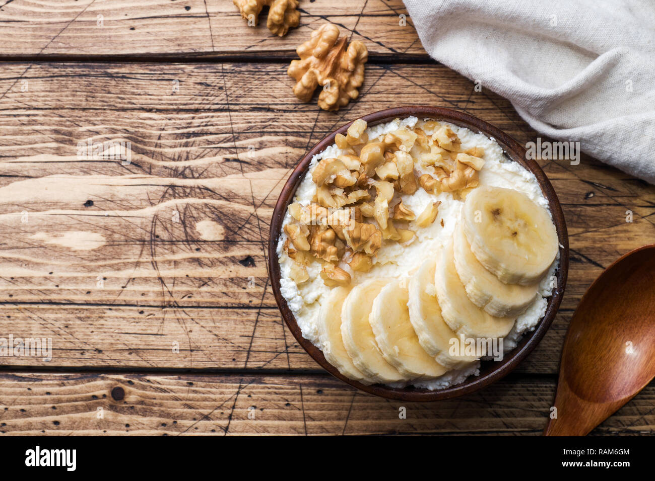 Healthy Breakfast Cottage Cheese With Banana And Walnuts On