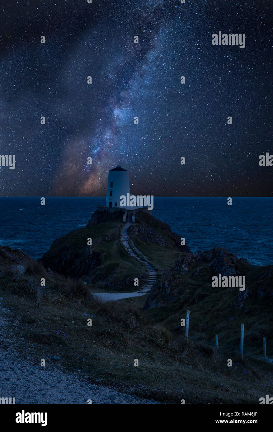 Stunning vibrant Milky Way composite image over landscape of lighthouse ...