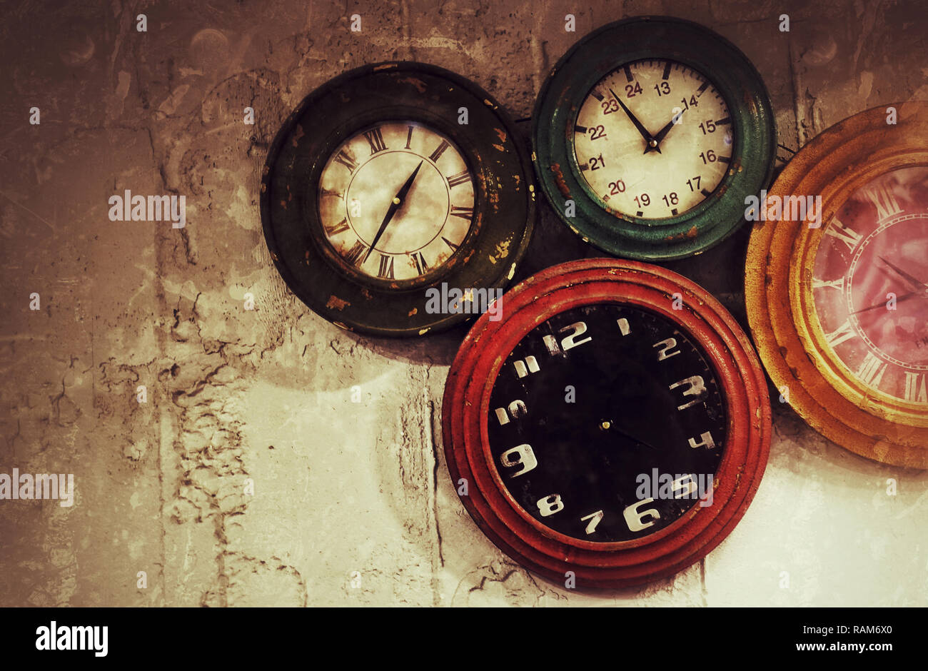 Abstract Retro Clocks on the Stone Wall Background Stock Photo
