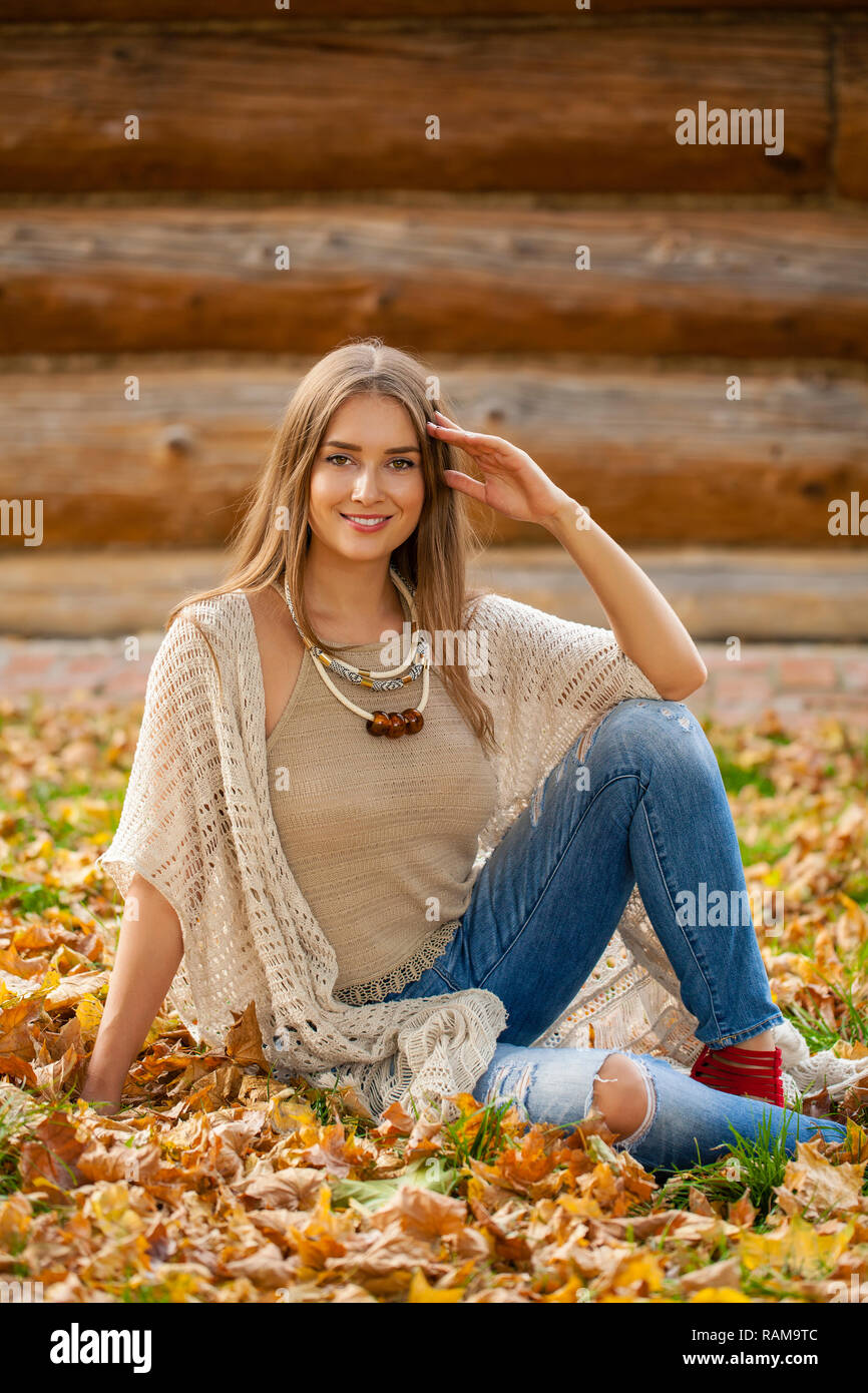 Young beautiful woman in the autumn park Stock Photo - Alamy