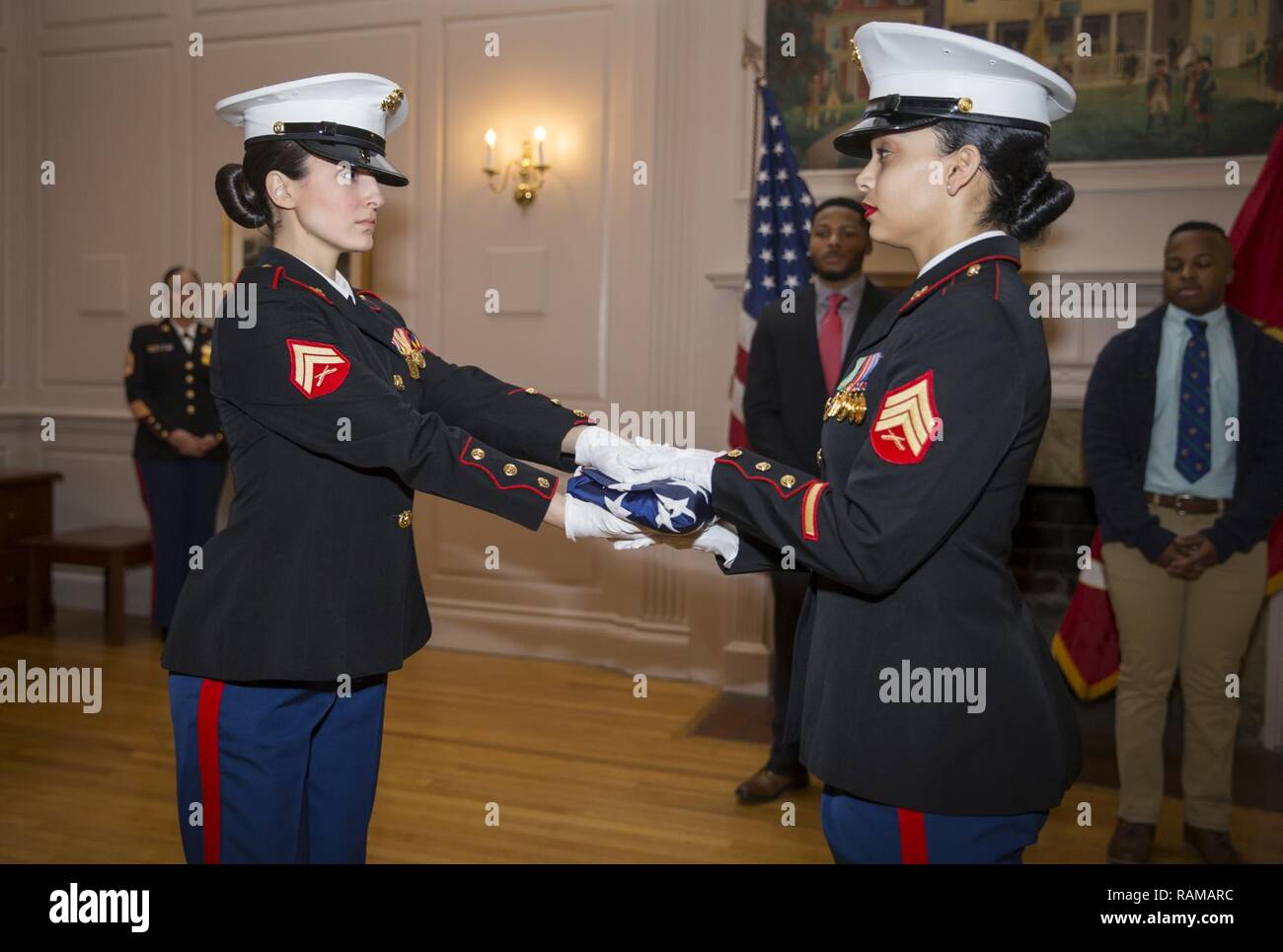 U.S. Marines pass the American flag during the Old Glory tribute at the ...