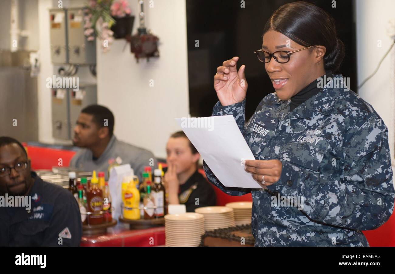SEA OF JAPAN (Feb. 16, 2017) Boatswain’s Mate 2nd Class Helen Clemons, assigned to the forward-deployed Arleigh Burke-class guided-missile destroyer USS McCampbell (DDG 85), sings during McCampbell’s African American History Month celebration. McCampbell is on patrol in the U.S. 7th Fleet area of operations in support of security and stability in the Indo-Asia-Pacific region. Stock Photo
