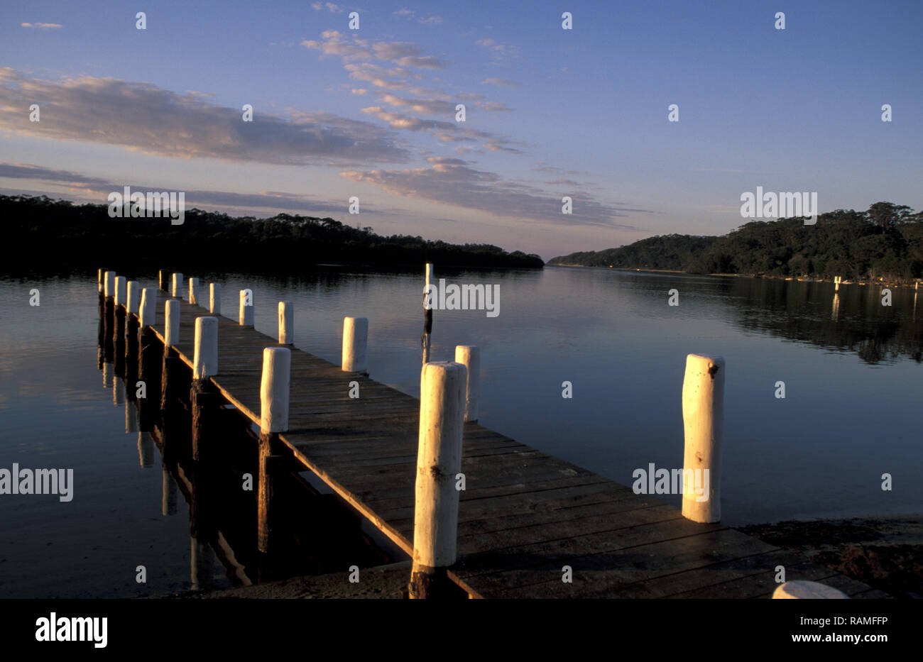 SUNRISE OVER ONE OF THE MANY PRIVATE JETTIES, SUSSEX INLET, NSW, AUSTRALIA Stock Photo