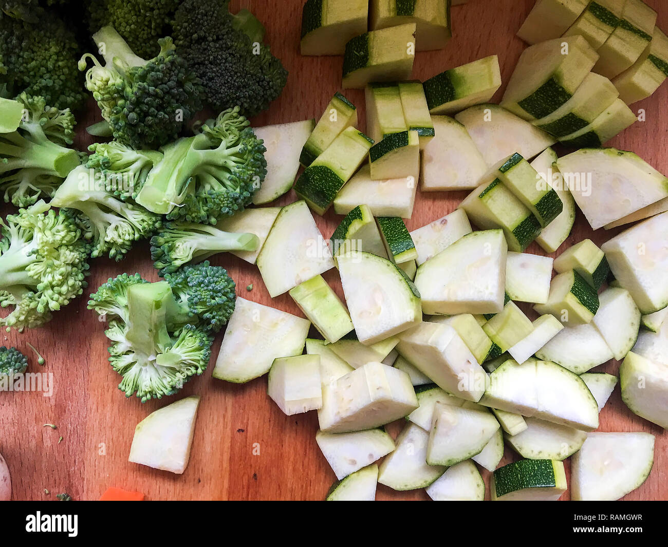 Chopped Brokoli and Pumpkin on Kitchen Table ready to make Food Stock Photo