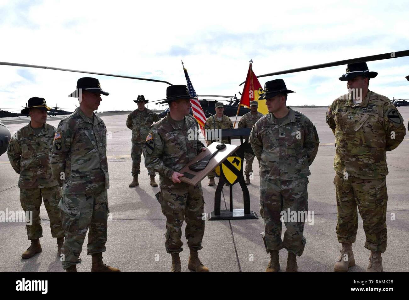 1st Air Cavalry Brigade commander Col. Cain Baker (center-left) presents the Lt. Gen. Ellis D. Parker Award to 3rd Assault Helicopter Battalion, 227th Aviation Regiment commander Lt. Col. Nathan Surrey (center-right) Feb. 16 on Hood Army Air Field. Stock Photo