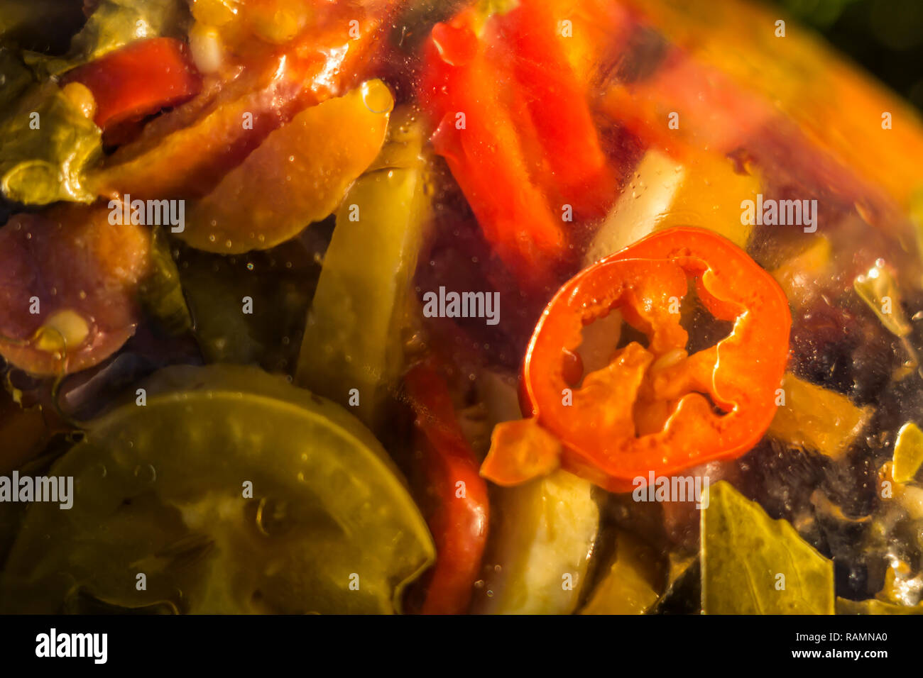 Marinated food. Assortment autumn preserves. Jars of pickled vegetables. Sealing farm vegetables in jars. Stock Photo