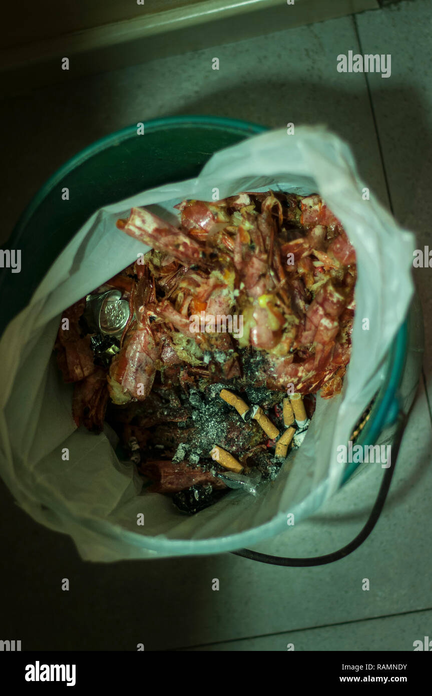 Rubbish bin with remnants of food for New Year's Eve Stock Photo