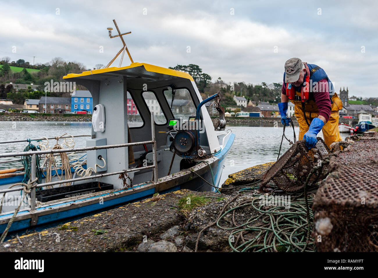 Bantry, West Cork, Ireland. 4th January, 2019. A fisherman unloads his crab pots after a fishing trip in Bantry Bay. Credit: Andy Gibson/Alamy Live News. Stock Photo