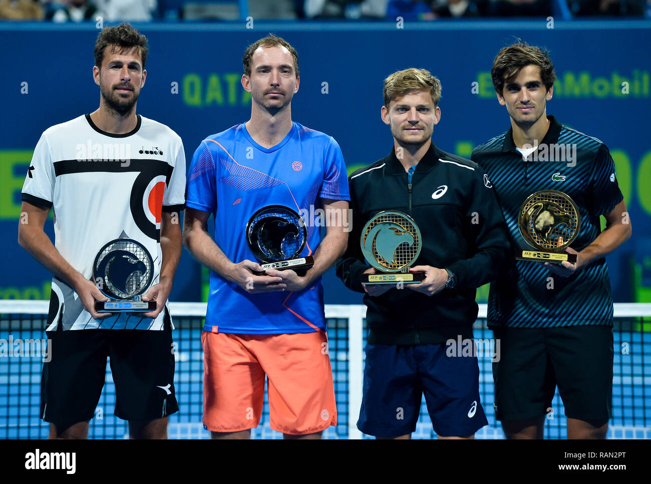 Doha, Qatar. 4th Jan, 2019. (SP)QATAR-DOHA-TENNIS-QATAR Belgium's Davif  Goffin (2nd R), Pierre-Hugues Herbert (R) of France, Robin Haase (L) and  Matwe Middelkoop (2nd L) of the Netherlands pose with their trophies after