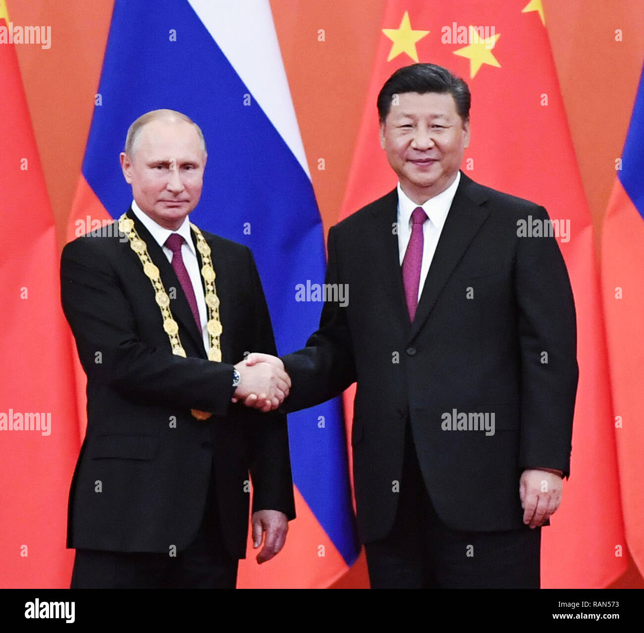 Beijing, China. 8th June, 2018. Chinese President Xi Jinping awards his ...