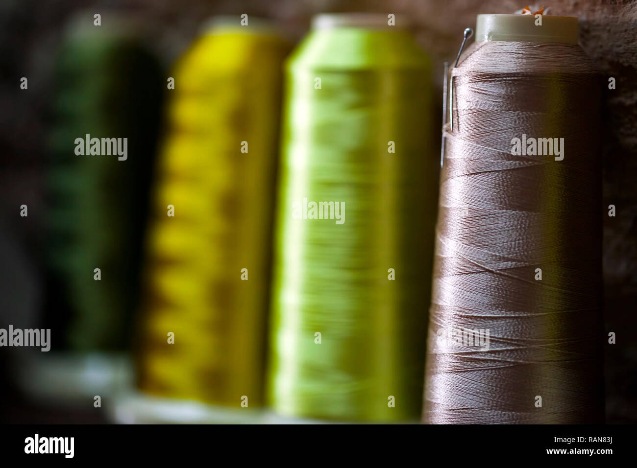 Fiber Fabric Roller on bobbin and light ropes Yarn Photo Stock Photo