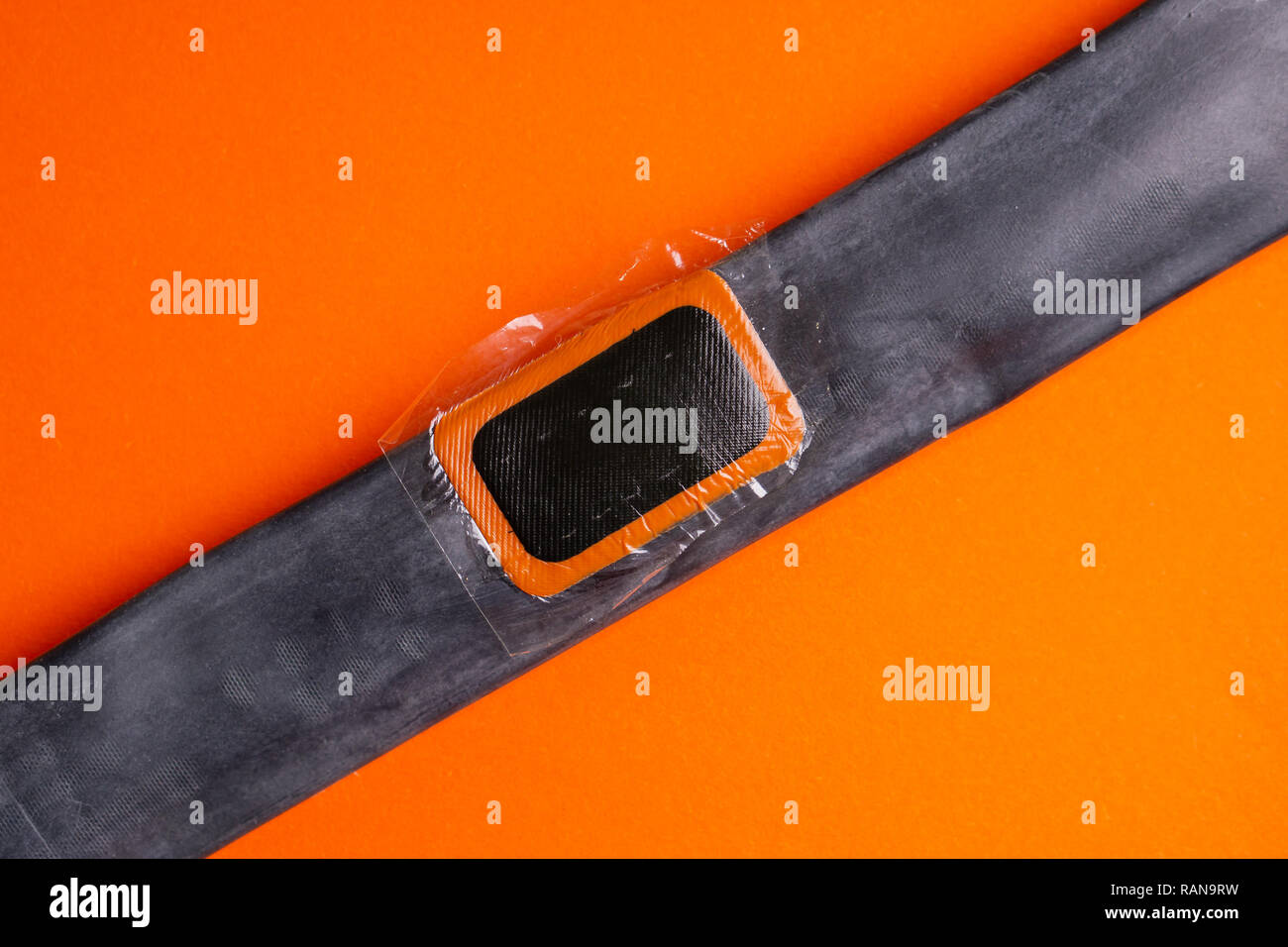 Patch on the camera of the bike. bicycle repair kit, wheels camera on wooden background Stock Photo