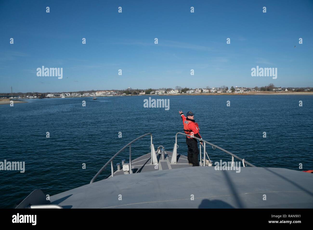 Seaman Christian Green, of Coast Guard Station Manasquan Inlet, stands