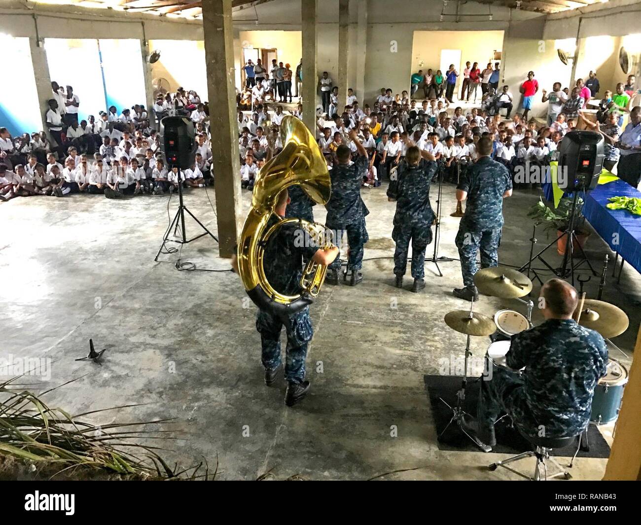 SANTA FE, Honduras (Feb. 22, 2017) Members of the U.S. Fleet Forces FF) Band perform for host nation school children in support of Continuing Promise 2017 (CP-17) in Sante Fe, Honduras. CP-17 is a U.S. Southern Command-sponsored and U.S. Naval Forces Southern Command/U.S. 4th Fleet-conducted deployment to conduct civil-military operations including humanitarian assistance, training engagements, and medical, dental, and veterinary support to Central and South America. Stock Photo