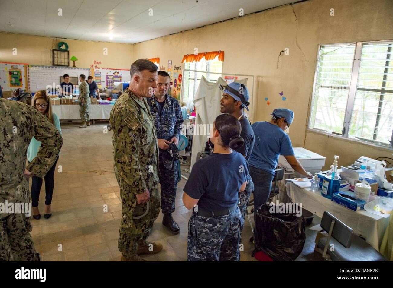TRUJILLO, Honduras (Feb. 23, 2017) – Rear Adm. Sean S. Buck (left), Commander U.S. Naval Forces Southern Command/U.S. 4th Fleet NAVSO/FOURTHFLT), speaks with Sailors during a tour of the Continuing Promise 2017 (CP-17) medical site in support of the mission's visit to Trujillo, Honduras. CP-17 is a U.S. Southern Command-sponsored and U.S. Naval Forces Southern Command/U.S. 4th Fleet-conducted deployment to conduct civil-military operations including humanitarian assistance, training engagements, and medical, dental, and veterinary support in an effort to show U.S. support and commitment to Cen Stock Photo