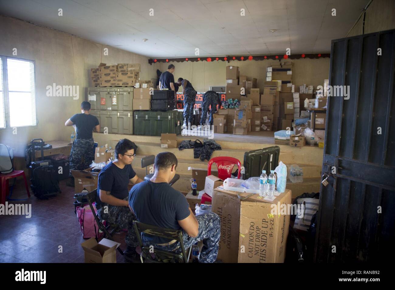 TRUJILLO, Honduras (Feb. 20, 2017) Sailors organize dental supplies at the Continuing Promise 2017 (CP-17) medical site in Trujillo, Honduras. CP-17 is a U.S. Southern Command-sponsored and U.S. Naval Forces Southern Command/U.S. 4th Fleet-conducted deployment to conduct civil-military operations including humanitarian assistance, training engagements, and medical, dental, and veterinary support to Central and South America. Stock Photo