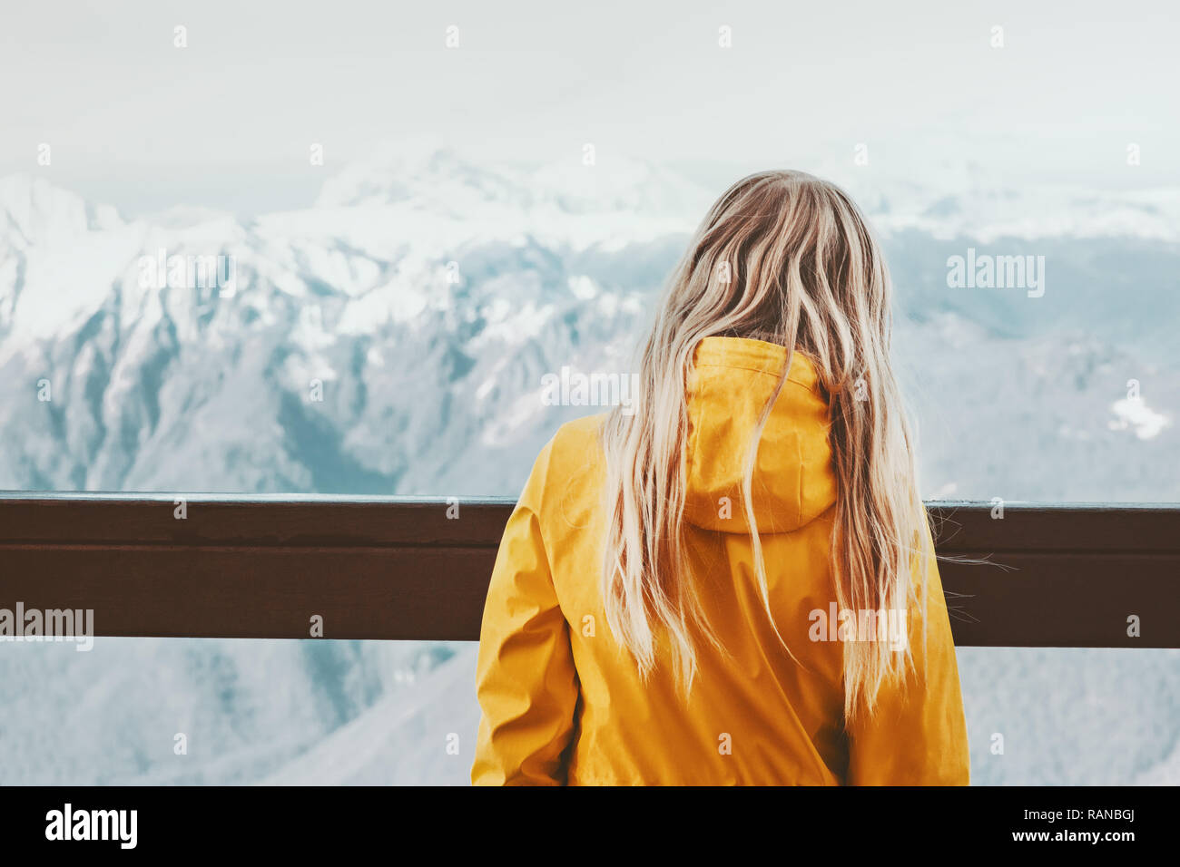 Woman traveler enjoying winter mountains landscape adventure travel lifestyle active vacations outdoor alone Stock Photo