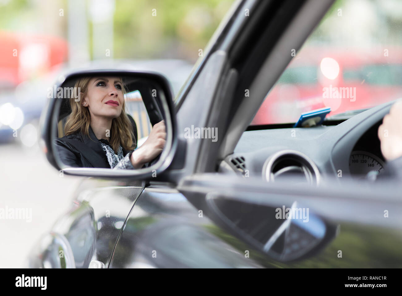Young lady driving her car Stock Photo - Alamy