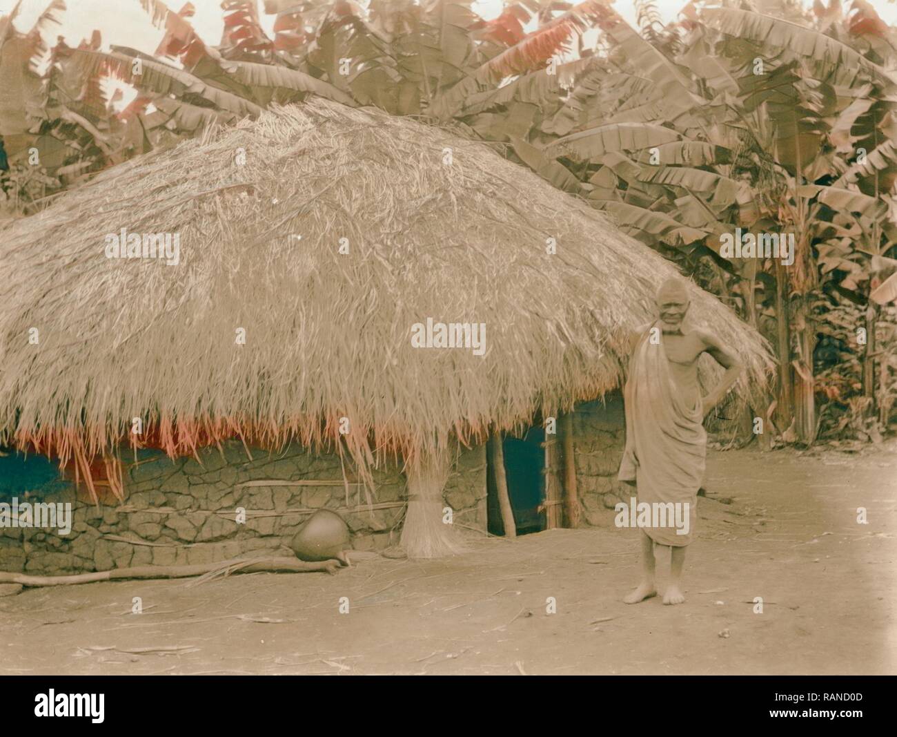 Uganda. From Hoima to Fort Portal. Native hut in a banana plantation. 1936,  Uganda. Reimagined by Gibon. Classic art reimagined Stock Photo - Alamy