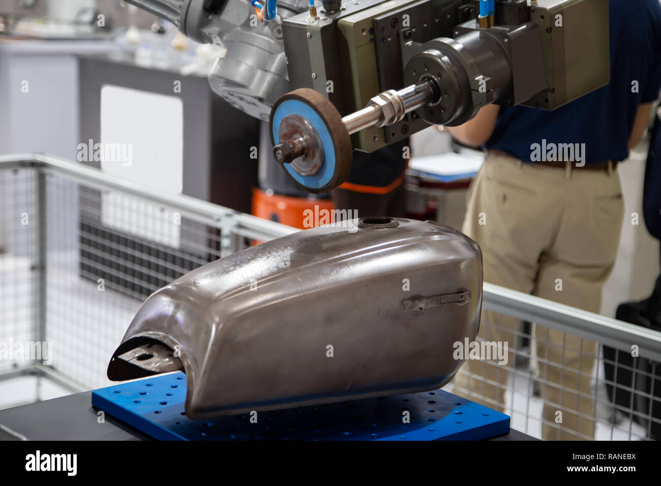 Robotic arm grinding motorcycle tank in motorcycle assembly factory Stock Photo Alamy