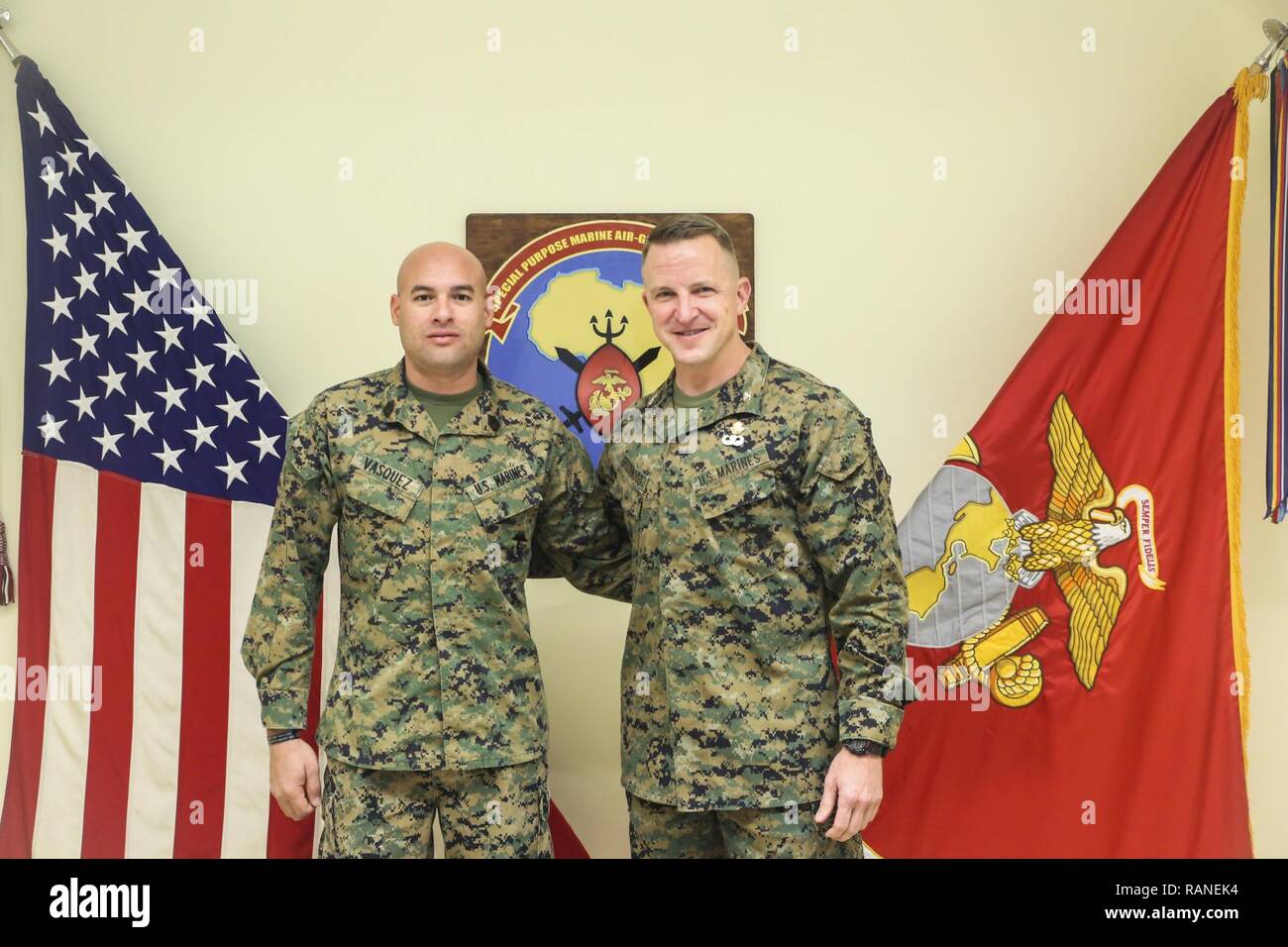 Gunnery Sgt. Juan Vasquez Jr., a U.S. Marine assigned to Special Purpose Marine Air-Ground Task Force – Crisis Response – Africa, poses for a photo with Col. Daniel Greenwood, the commanding officer of SPMAGTF-CR-AF, at Naval Air Station Sigonella, Italy, Feb. 25, 2017. Greenwood formerly served as the commanding officer for Marine Corps Recruiting Station Fort Lauderdale, Florida, while Vasquez was a poolee for the station in 2003. Stock Photo