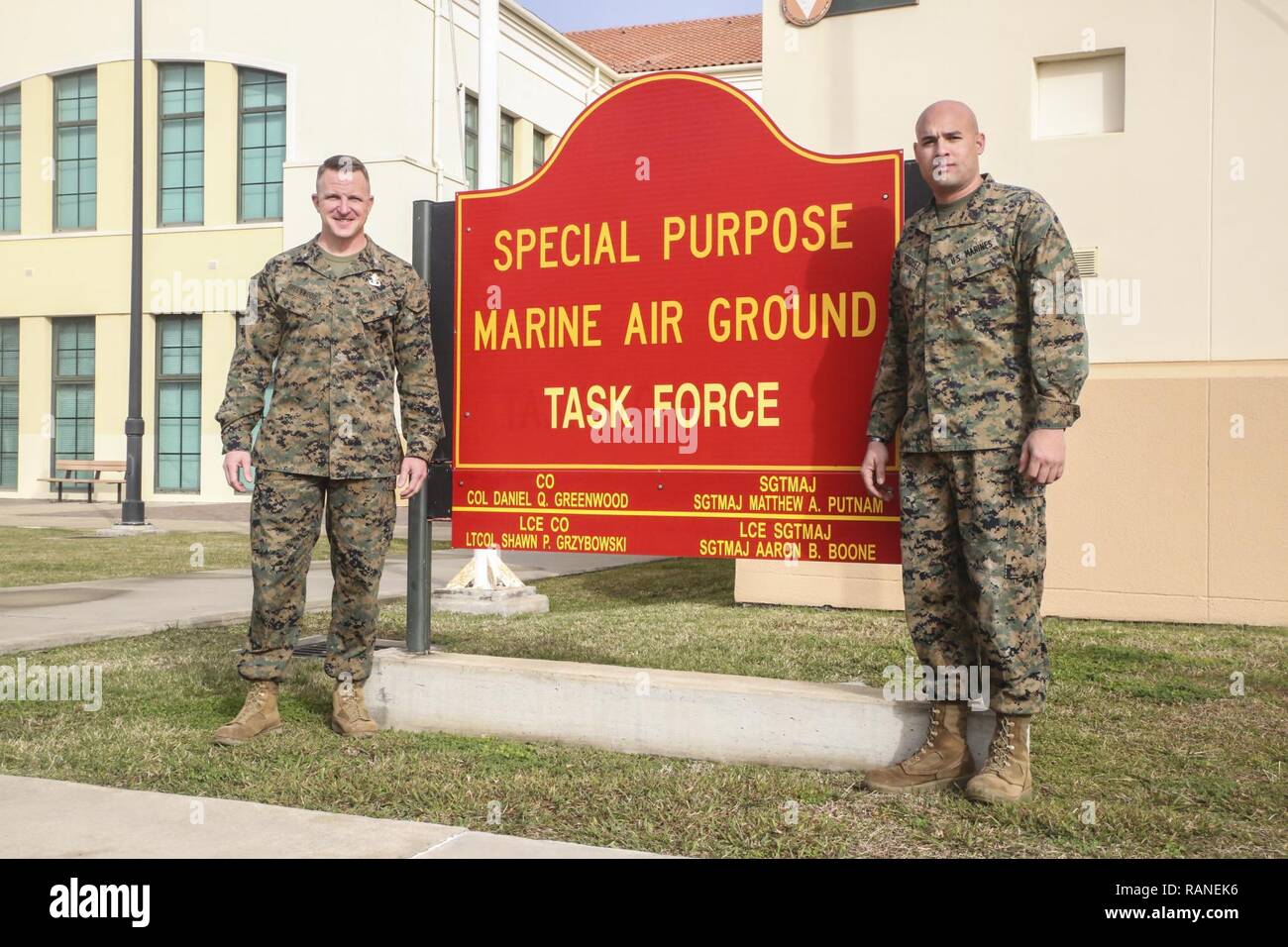 Gunnery Sgt. Juan Vasquez Jr., a U.S. Marine assigned to Special Purpose Marine Air-Ground Task Force – Crisis Response – Africa, right, poses for a photo with Col. Daniel Greenwood, the commanding officer of SPMAGTF-CR-AF, at Naval Air Station Sigonella, Italy, Feb. 25, 2017. Greenwood formerly served as the commanding officer for Marine Corps Recruiting Station Fort Lauderdale, Florida, while Vasquez was a poolee for the station in 2003. Stock Photo