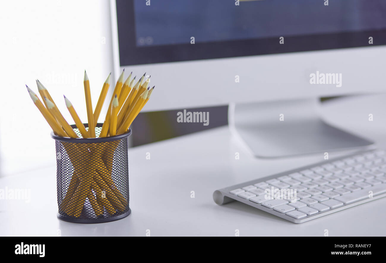 Graphite pencils in a metal grid-container. Concept. Stock Photo