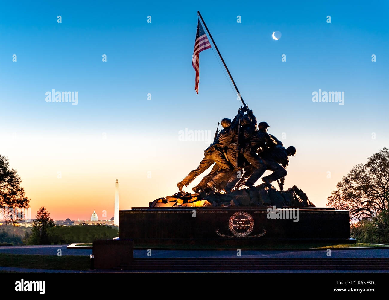 Marine War Memorial depicting the raising of the flag on Iwo Jima after the island was concurred by the US Marines. This image has the moon rising wit Stock Photo