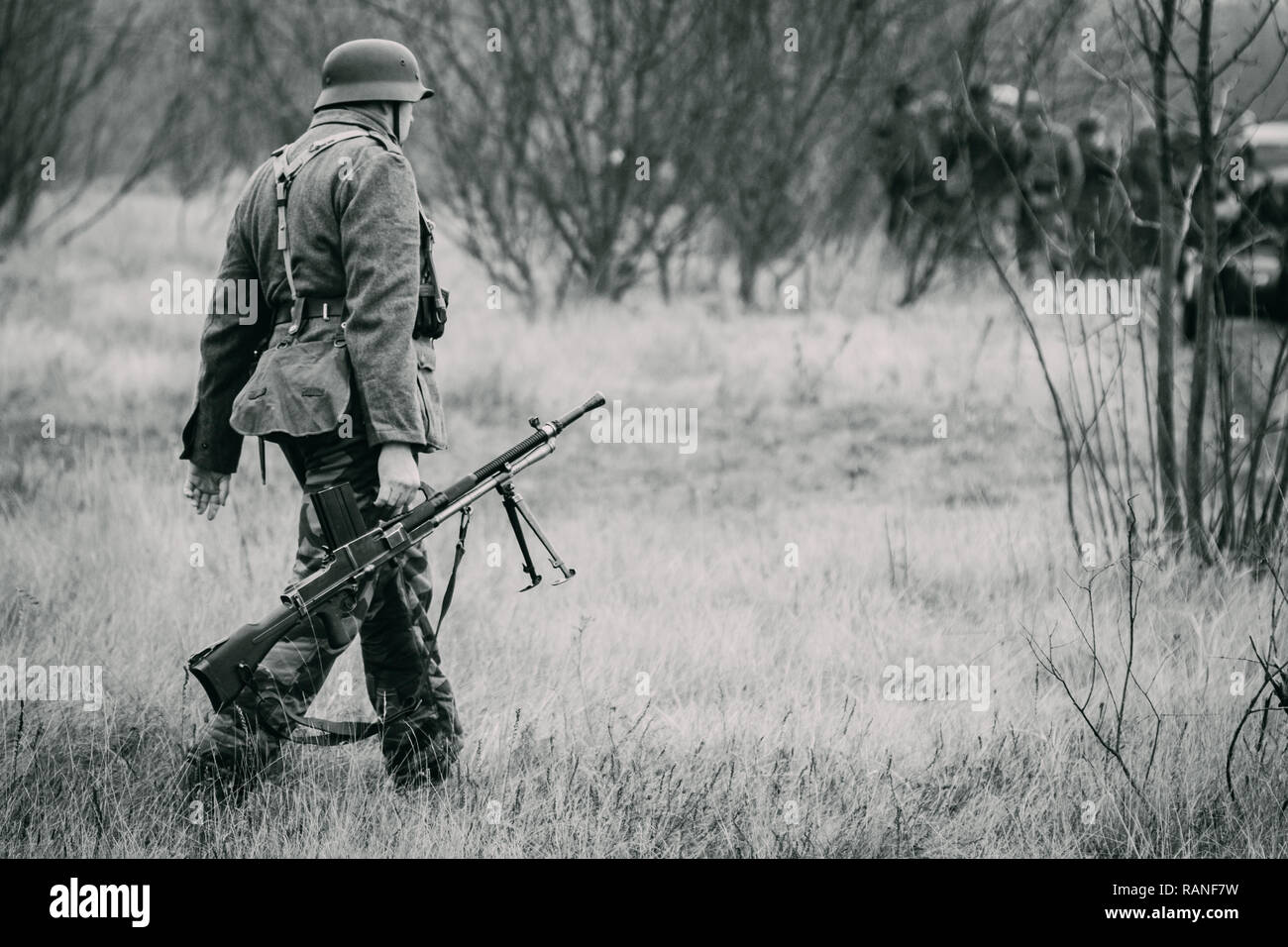 A German soldier of the Wehrmacht machine gunner with a Czech-made machine  gun goes across the field to a position for defense. Black and white photog  Stock Photo - Alamy