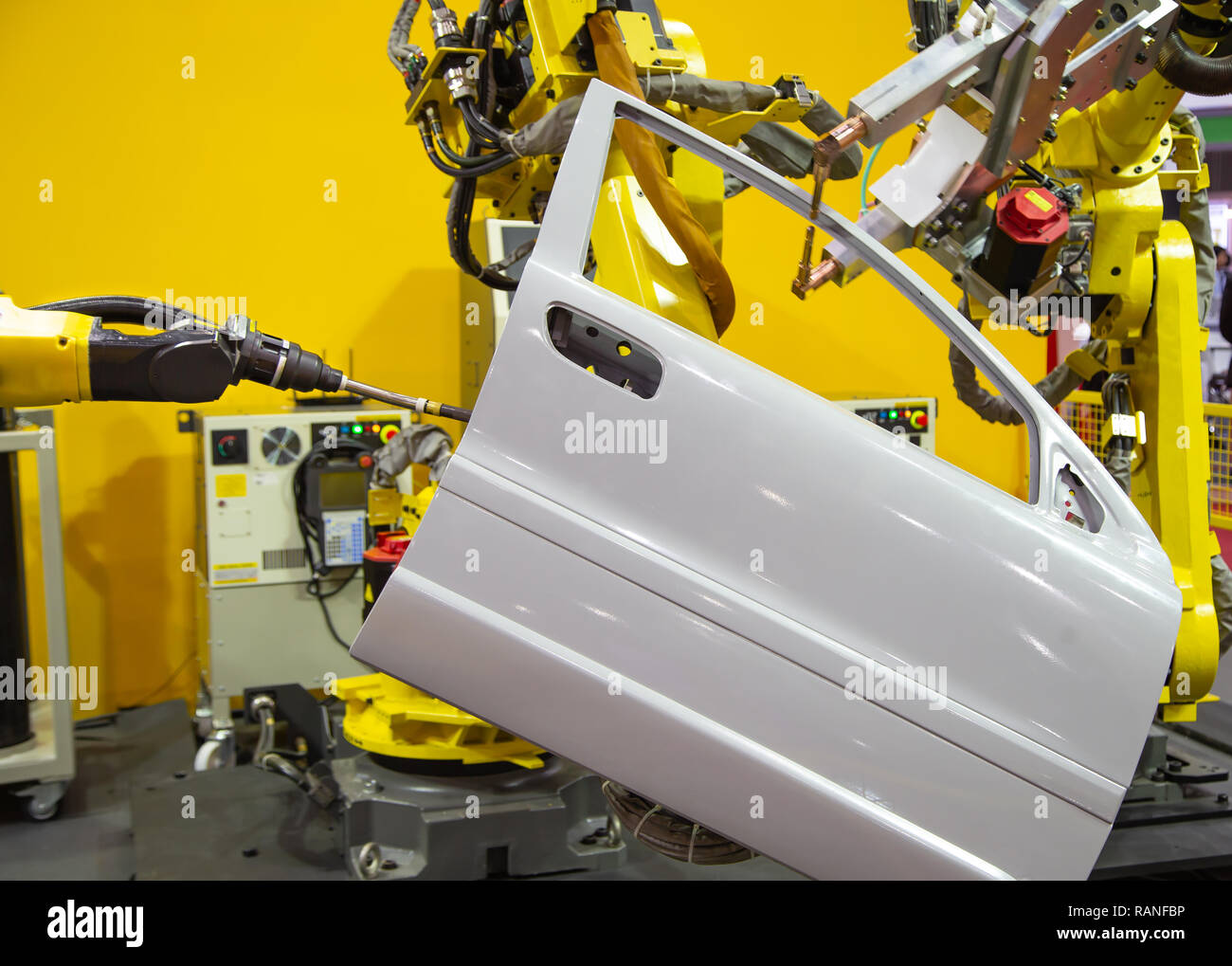 Robot arm demonstrate spot welding car door Stock Photo Alamy