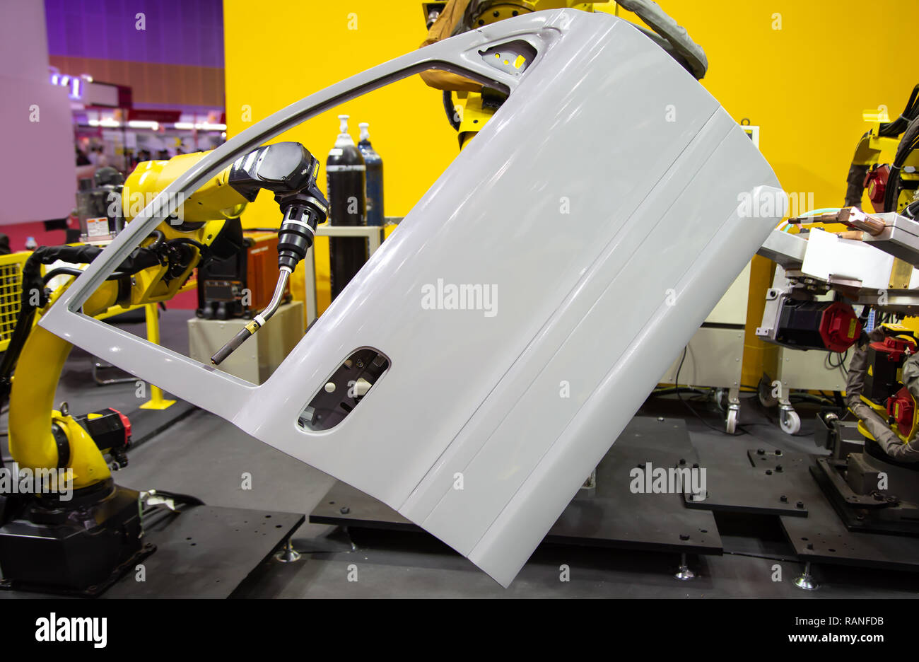Robot arm demonstrate spot welding car door Stock Photo Alamy