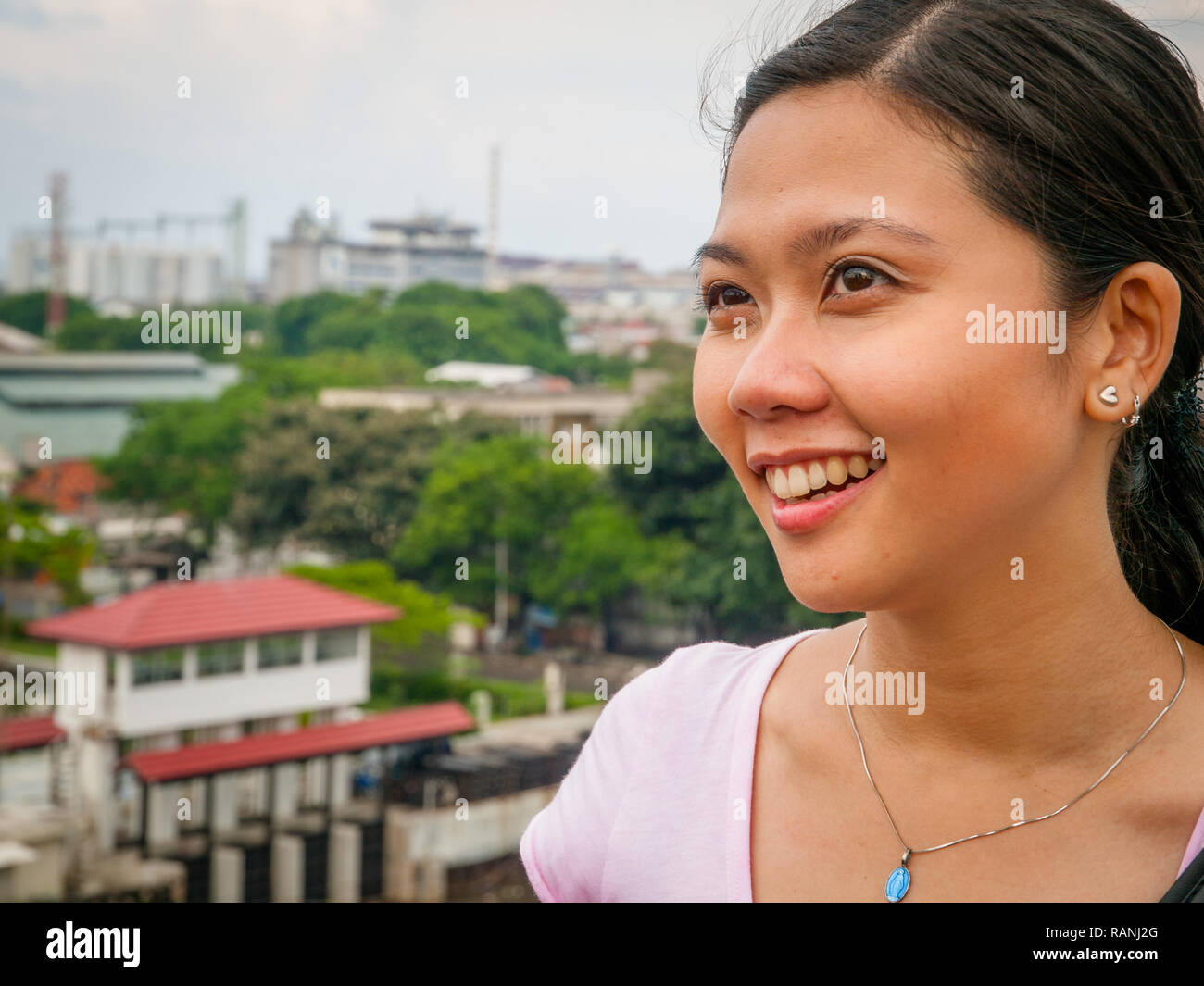 Indonesian girl on top view pose and looking away Stock Photo - Alamy