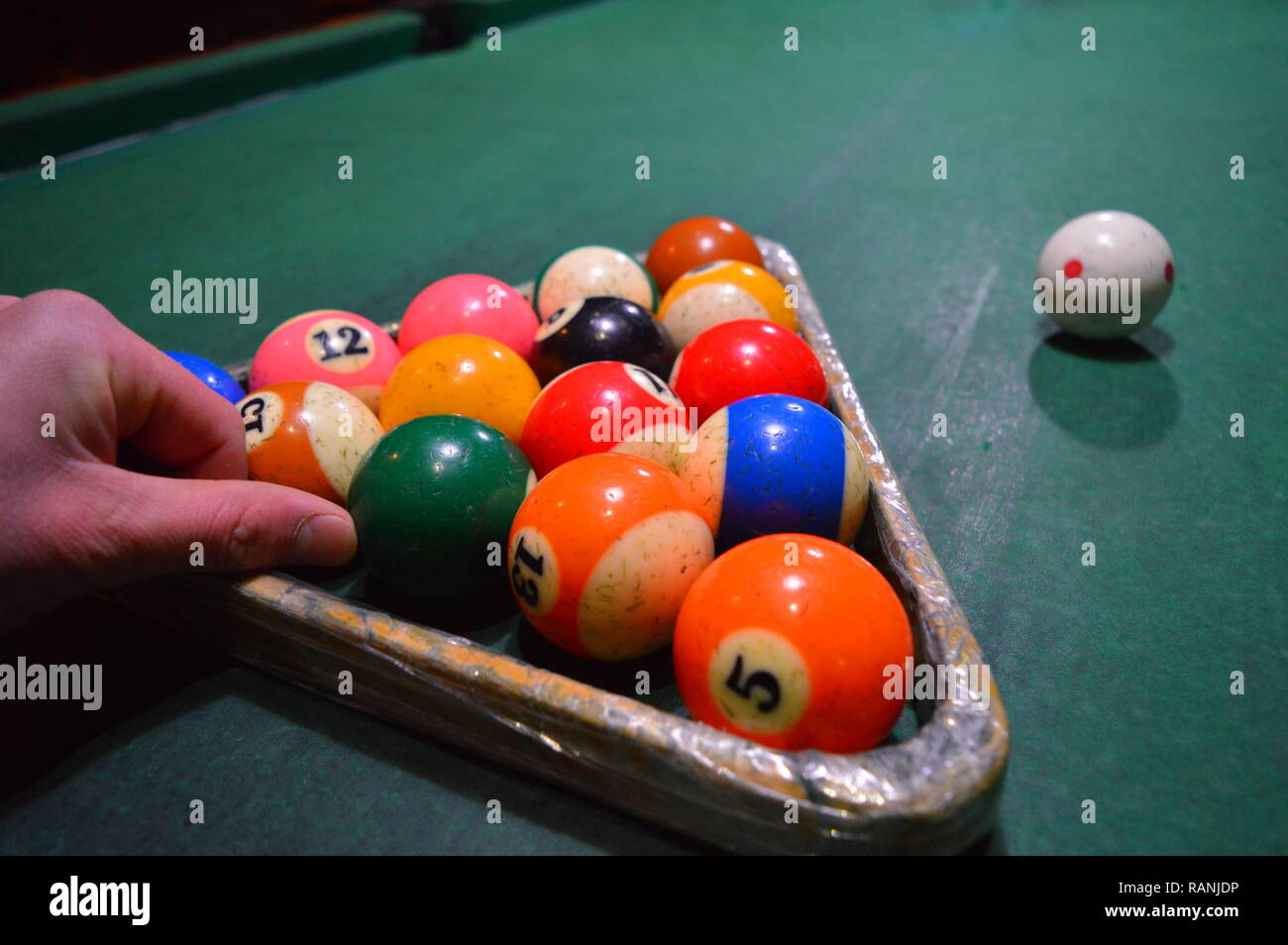 Game of pool, person playing pool and hitting balls Stock Photo Alamy