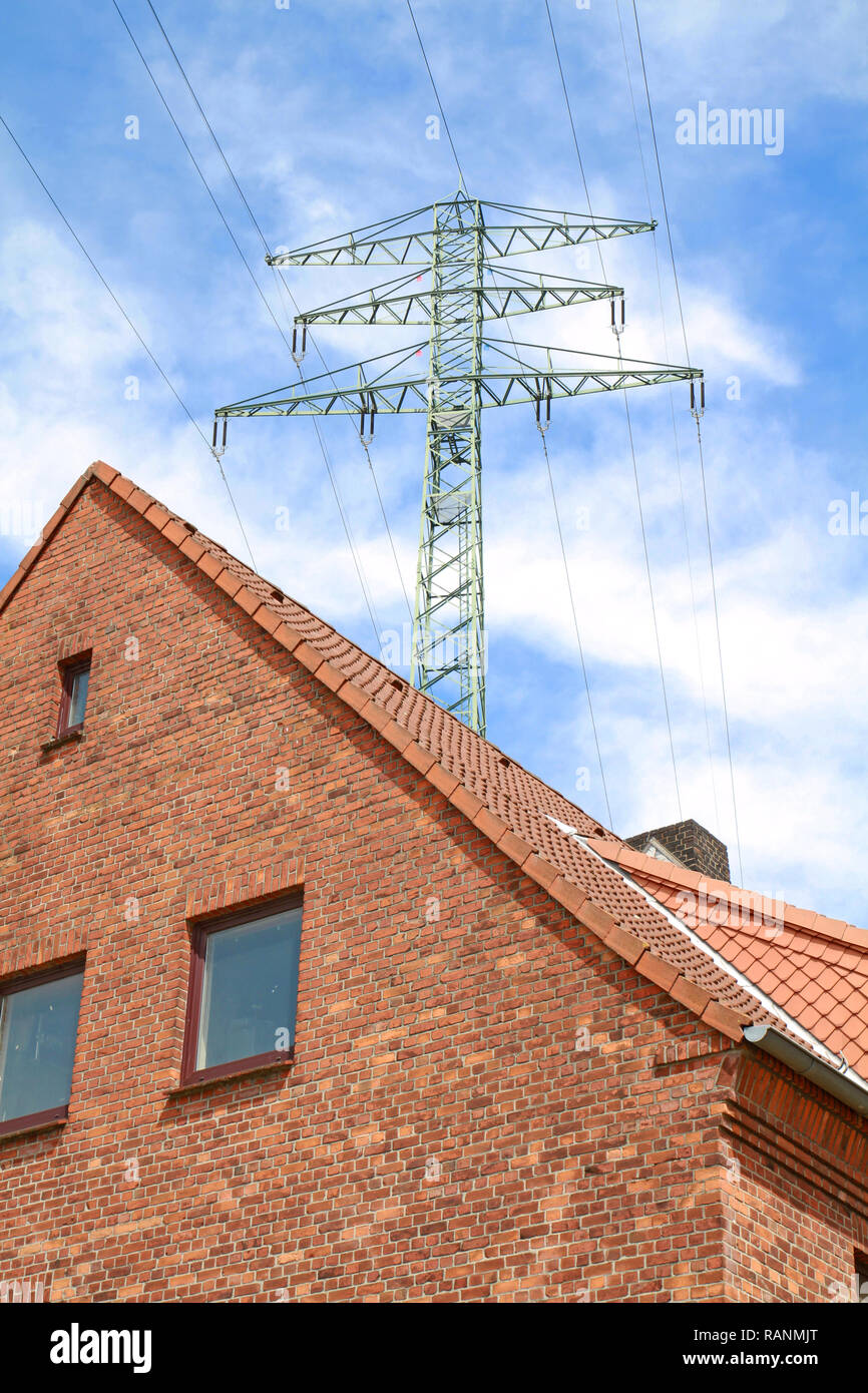 high voltage power line over dwelling Stock Photo Alamy