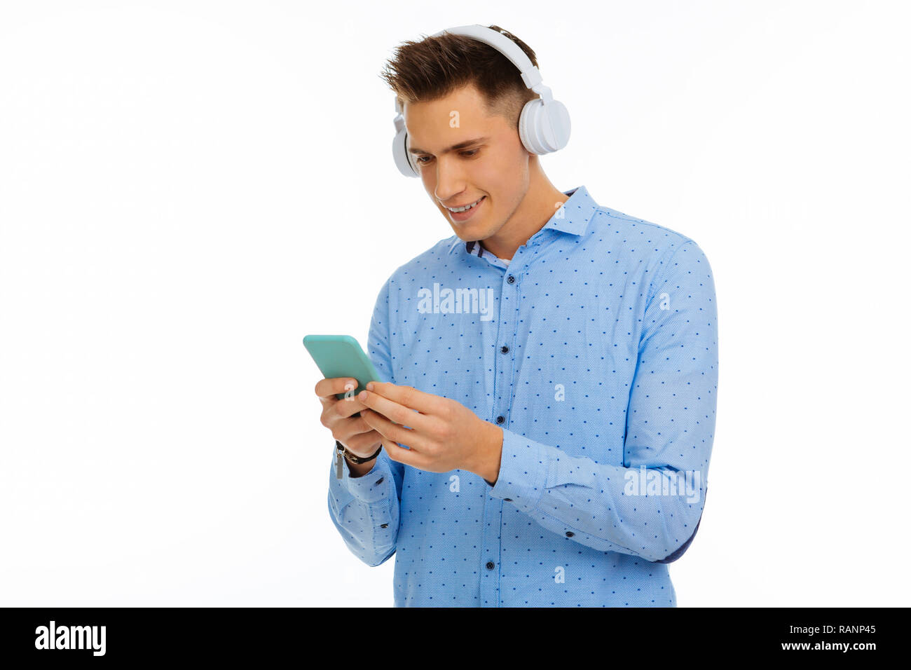 Delighted nice man looking at the smartphone screen Stock Photo