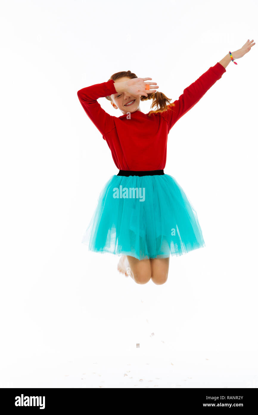 Cheerful positive girl being in the air Stock Photo