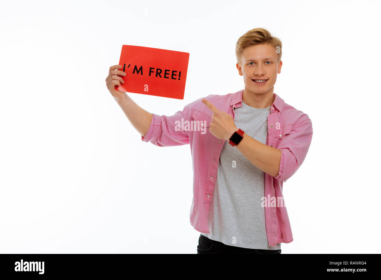 Nice cheerful young man feeling absolutely free Stock Photo - Alamy