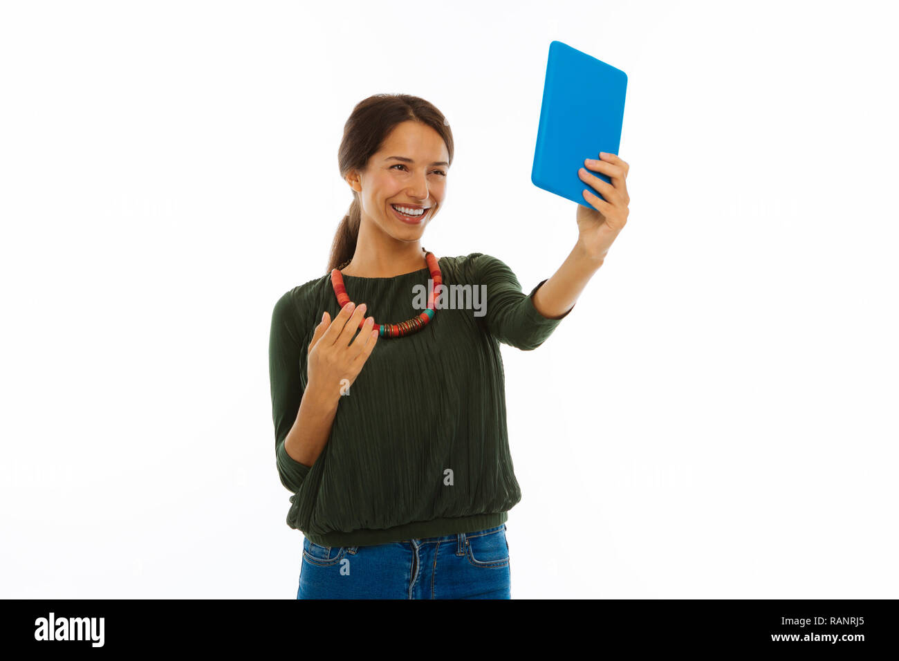 Happy nice young woman taking a selfie Stock Photo