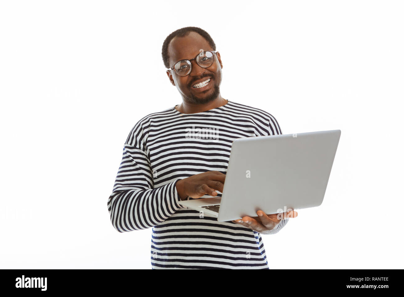 Positive nice man working on his laptop Stock Photo