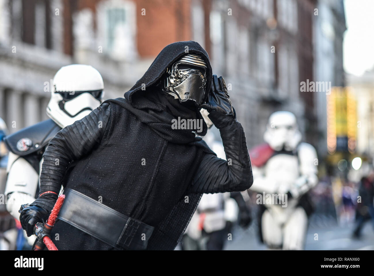 Kylo Ren costume of fictional character in the Star Wars films at London's  New Year's Day Parade, UK. Listening, cupping ear, to boos from crowds  Stock Photo - Alamy