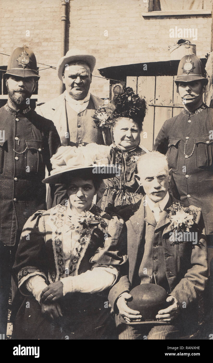 Vintage Photographic Postcard of a Possible Convict Wedding Party With Two Policemen Present. Policemen Have Collar No's 452.X and 649.X. Stock Photo
