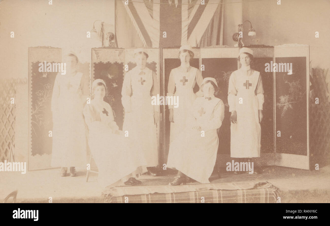 Vintage Photographic Postcard Showing a Group of Red Cross Ladies. Stock Photo
